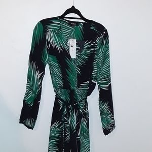 Long maxi dress. Has belt. Brand New.
